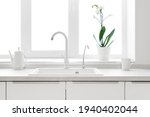 Kitchen counter window in pastel colors with sink for dishes