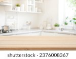 Wooden table top view for product montage over blurred kitchen interior background