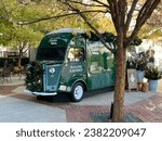 Small photo of Charlotte, NC - October 30, 2023: Ralph's Ralph Lauren coffee truck decorated for the holidays in Phillips Place in Charlotte, NC