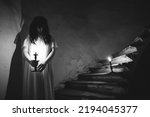 Small photo of Ghost in abandoned, haunted house. Horror scene of scary spirit of a woman, halloween concept.