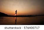 Silhouette Of Woman Running In...