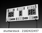 Small photo of Baseball scoreboard with details of score ball strike innings black and white