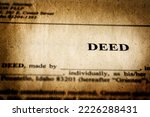 Small photo of Deed to real estate transfer title ownership to land or home old weathered paper