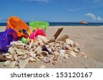 Beach  Shells And Sand Buckets 