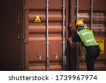 Foreman is opening the container door to inspect the goods inside the container, business for international shipping by plane and container ship.