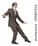 Small photo of Businessman walking gingerly on isolated white background, rear view