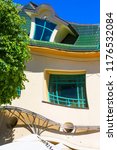 Small photo of SOPOT, POLAND - JUNE 6, 2018: Krzywy Domek ( crooked little house ) at Monte Cassino Street. It is an unusually shaped building, built in 2004