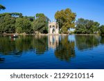 Small photo of Rome, Italy - October 10, 2020: Villa Borghese gardens, 18th century Temple of Aesculapius situated on the shore of the pond