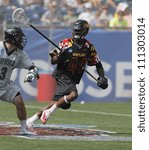 Small photo of FOXBOROUGH - 28 MAY: Goran Murray (44), Maryland, defends the goals against Chris Layne (3), Loyola, at the NCAA Men's Division 1 Lacrosse Championship game in Foxborough, Massachusetts, 28 May 2012