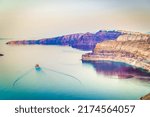 Small photo of Aegan sea and view of Santorini caldera with boats and ferries, Greece, toned image