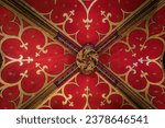 Small photo of Strasbourg, France - May 31, 2023: Ornate and colorful detail of the Gothic archway in the rood screen of Saint Pierre le Jeune Protestant church