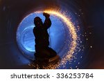 A Worker Works Inside A Pipe On ...