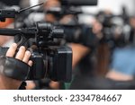 Small photo of Dynamic media presence as TV cameras capture the energy of an outdoor press conference, delivering comprehensive coverage in an engaging setting