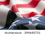 Stars and Stripes Flag background; rippling red white and blue silken American flag
