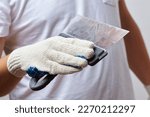 Men with putty knife in hands