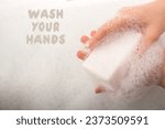 Hand washing and soap foam on a ...