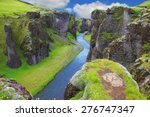 Neverland Iceland. The picturesque canyon Fjadrargljufur, green cliffs and blue water of the river