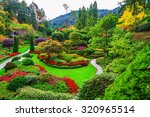 Butchart Gardens -  gardens on Vancouver Island. Flower beds of colorful flowers and walking paths for tourists. The world-famous masterpiece of park architecture
