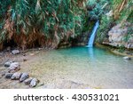 Beautiful waterfall and small scenic lake with clear water. The national park Ein Gedi, Israel