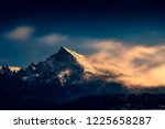 Night time landscape view of mountain peak Krivan with moonlight and clouds, High Tatras, Slovakia, Europe