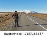 Man standing on the road heading toward the unknown.  Long time ago me and my brother Kyle here,
We was hitchhiking down a long and lonesome road