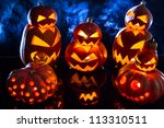 group strange pumpkins on black ... | Shutterstock . vector #113310511