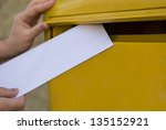 Man's Hands Posting A Letter In ...