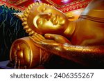 Small photo of The reclining Buddha in the Nirvana posture is a reminder to live in carelessness. Because all bodies are impermanent.
