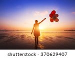 happiness concept, positive emotions, happy girl with multicolored balloons enjoying summer beach at sunset 