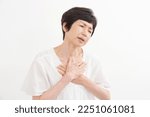 Small photo of Asian senior woman having a palpitation of the heart in white background