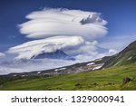 Small photo of The gargantuan lenticular cloud had hanged over volcano Kamen. Notably, this natural UFO has diameter of about ten kilometers. Kamchatka Peninsula. Klyuchevskoy Nature park