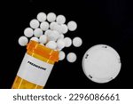 Small photo of Prednisone Rx medical pills in plactic Bottle with tablets. Pills spilling out from yellow container.