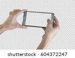 Taking photo with mobile smart phone isolated on transparent background with clipping path for the screen.