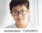 Small photo of Little asian chinese boy shilly-shally and smile pose .