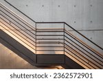 Small photo of Interior front elevation view at the black steel staircase and background of modern loft concrete wall.
