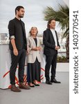 Small photo of CANNES, FRANCE - MAY 21, 2019: Amador Arias Mon, Benedicta Sanchez Vila and Director Oliver Laxe attend the photocall for "Viendra Le Feu" during the 72nd annual Cannes Film Festival