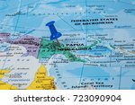 Small photo of Map of Papuia New Guinea with a blue pushpin stuck