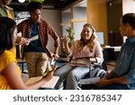 Small photo of Happy diverse male and female colleagues in discussion using tablet in casual office meeting. Casual office, teamwork, disability, inclusivity, business and work, unaltered.
