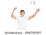 young man throwing currency... | Shutterstock . vector #398709397
