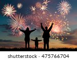 Happy family look at holiday fireworks in sky, celebration card