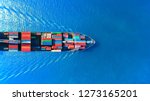 Aerial top view container ship full load container for logistics import export, shipping or transportation concept background.