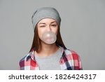 Closeup Of Teen Girl Blowing...
