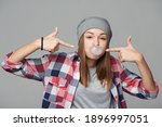 Cheeky Teen Girl Blowing...