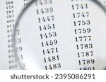 Small photo of document with many numbers, data encrypt and magnifying glass,. Cipher encryption code or data, closeup