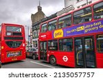 Small photo of London, UK - March 5 2022: Red double decker buses on Fulham Broadway, West London