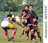 Small photo of KUALA LUMPUR, MALAYSIA - OCTOBER 15: Unidentified participants in action during a 10s Rugby Tournament Vice-Chancellor Cup at National Defense University Of Malaysia, Kuala Lumpur, Malaysia on October 15, 2011.