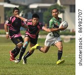 Small photo of KUALA LUMPUR, MALAYSIA - OCTOBER 15: Unidentified participants in action during a 10s Rugby Tournament Vice-Chancellor Cup at National Defense University Of Malaysia, Kuala Lumpur, Malaysia on October 15, 2011.