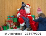 Children Visiting Santa In His...