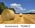 Hay Bales In A Field On A...
