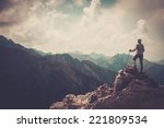 Woman hiker on a top of a mountain 